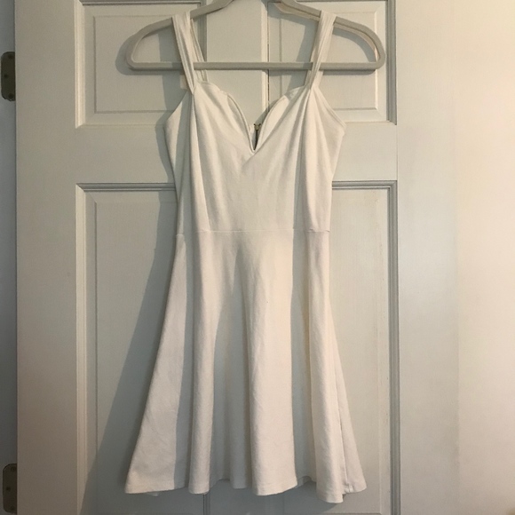 Charlotte Russe Dresses & Skirts - Beautiful White Dress with a Plunging Neckline